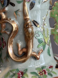 A pair of Chinese Canton famille rose celadon-ground 'court scene' vases, 19th C.