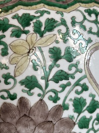 A Chinese famille verte jar with floral design and a wooden cover, Kangxi