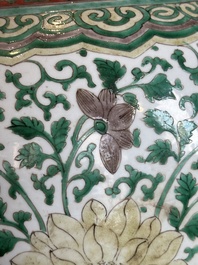 A Chinese famille verte jar with floral design and a wooden cover, Kangxi