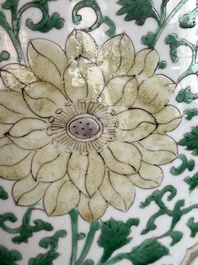 A Chinese famille verte jar with floral design and a wooden cover, Kangxi