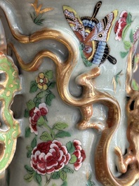 A pair of Chinese Canton famille rose celadon-ground 'court scene' vases, 19th C.