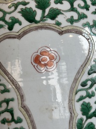 A Chinese famille verte jar with floral design and a wooden cover, Kangxi