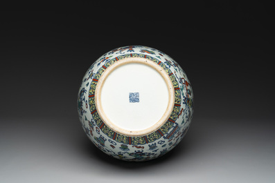 A Chinese doucai 'antiquities' 'hu' vase, Qianlong mark, 19th C.