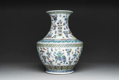 A Chinese doucai 'antiquities' 'hu' vase, Qianlong mark, 19th C.