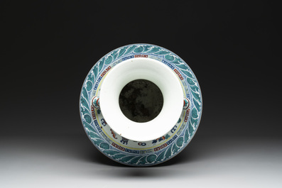 A Chinese doucai 'antiquities' 'hu' vase, Qianlong mark, 19th C.