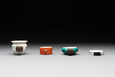 A collection of nine Chinese blue and white, monochrome and famille rose bird feeders, 19th C.