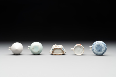 A collection of nine Chinese blue and white, monochrome and famille rose bird feeders, 19th C.