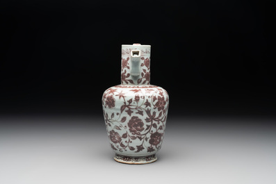 A Chinese copper-red and white 'flower scroll' ewer, Ming or later