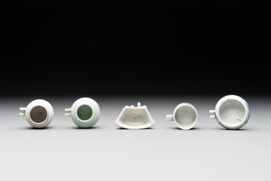 A collection of nine Chinese blue and white, monochrome and famille rose bird feeders, 19th C.