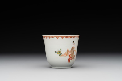 A Chinese famille rose cup and saucer with a lady playing flute, a boy and a phoenix, Qianlong