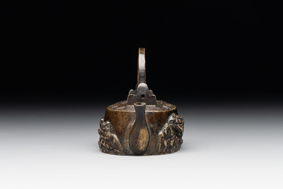 A Japanese bronze 'shishi lions' water dropper, Meiji, 19th C.