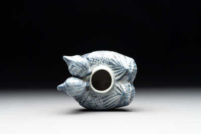 A Chinese blue and white 'double mandarin duck' ewer or water dropper on wooden stand, Ming, ca. 1500