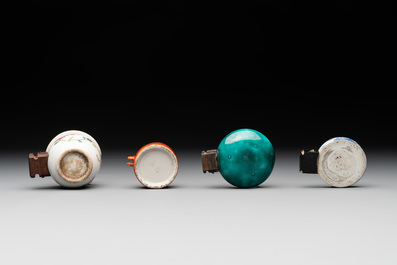 A collection of nine Chinese blue and white, monochrome and famille rose bird feeders, 19th C.