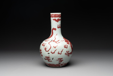 A Chinese copper-red and white 'dragon' bottle vase, 18th C.