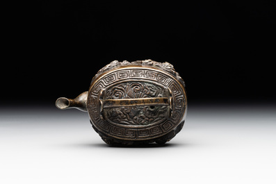 A Japanese bronze 'shishi lions' water dropper, Meiji, 19th C.