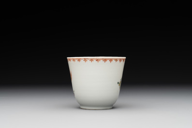 A Chinese famille rose cup and saucer with a lady playing flute, a boy and a phoenix, Qianlong