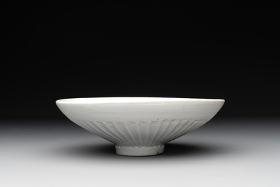A Chinese incised white-glazed bowl and a pair of turquoise-glazed vases, Ming
