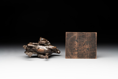 A rare Chinese bronze Vaishravana on horseback with wooden stand, Yuan