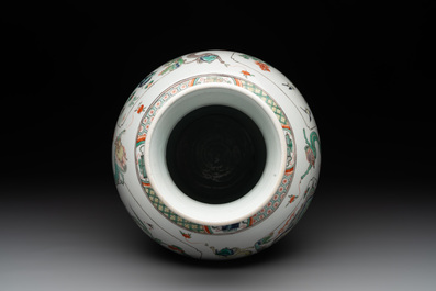 A fine Chinese famille verte 'mythical creatures' vase on a reticulated wooden stand, Kangxi