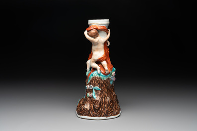 A Chinese export faux-bois stand with two putti and two famille rose boys, Qianlong/Jiaqing