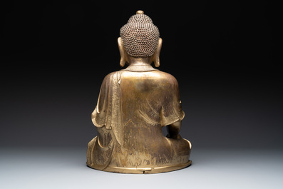 An impressive and large Chinese gilt bronze Buddha, Ming, 16th C.