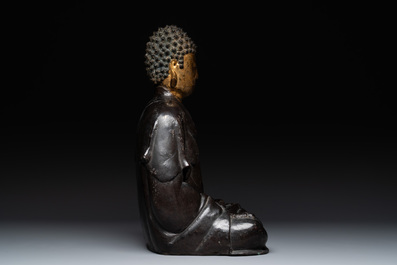 A large Chinese lacquered and gilt bronze Buddha, 17th C.
