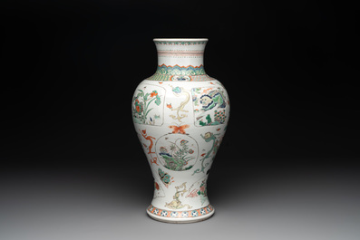 A fine Chinese famille verte 'mythical creatures' vase on a reticulated wooden stand, Kangxi