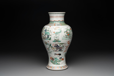 A fine Chinese famille verte 'mythical creatures' vase on a reticulated wooden stand, Kangxi