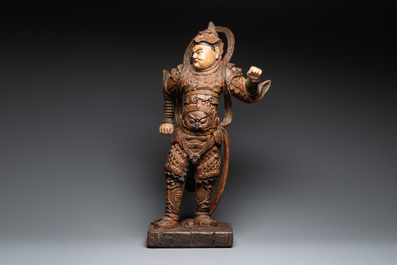 A large Chinese polychrome-lacquered wooden figure of a Guardian King, 18/19th C.