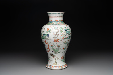 A fine Chinese famille verte 'mythical creatures' vase on a reticulated wooden stand, Kangxi
