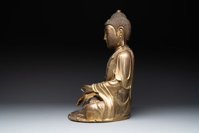 An impressive and large Chinese gilt bronze Buddha, Ming, 16th C.