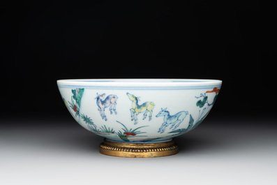 A Chinese doucai 'deer' bowl with gilt bronze stand, Chenghua mark, 18th C.