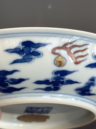 An imperial Chinese blue, white and iron-red 'dragon' plate, Qianlong mark and of the period