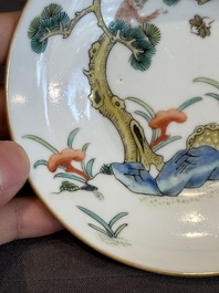 A pair of Chinese famille rose 'monkey and deer' cups and saucers, Tongzhi mark and of the period