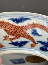 An imperial Chinese blue, white and iron-red 'dragon' plate, Qianlong mark and of the period