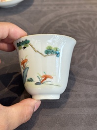 A pair of Chinese famille rose 'monkey and deer' cups and saucers, Tongzhi mark and of the period