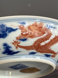 An imperial Chinese blue, white and iron-red 'dragon' plate, Qianlong mark and of the period