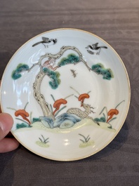 A pair of Chinese famille rose 'monkey and deer' cups and saucers, Tongzhi mark and of the period