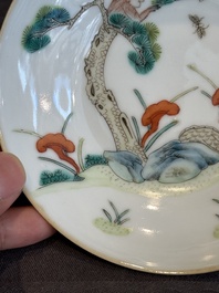 A pair of Chinese famille rose 'monkey and deer' cups and saucers, Tongzhi mark and of the period
