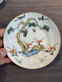A pair of Chinese famille rose 'monkey and deer' cups and saucers, Tongzhi mark and of the period