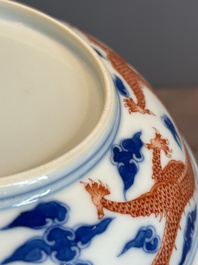 An imperial Chinese blue, white and iron-red 'dragon' plate, Qianlong mark and of the period