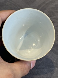 A pair of Chinese famille rose 'monkey and deer' cups and saucers, Tongzhi mark and of the period