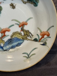 A pair of Chinese famille rose 'monkey and deer' cups and saucers, Tongzhi mark and of the period