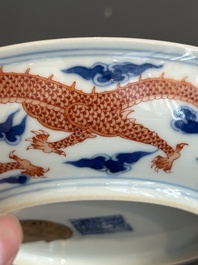 An imperial Chinese blue, white and iron-red 'dragon' plate, Qianlong mark and of the period