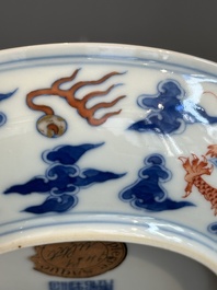 An imperial Chinese blue, white and iron-red 'dragon' plate, Qianlong mark and of the period