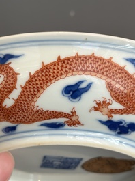 An imperial Chinese blue, white and iron-red 'dragon' plate, Qianlong mark and of the period