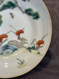 A pair of Chinese famille rose 'monkey and deer' cups and saucers, Tongzhi mark and of the period