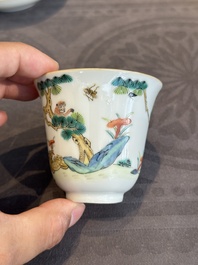 A pair of Chinese famille rose 'monkey and deer' cups and saucers, Tongzhi mark and of the period