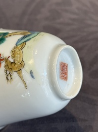 A pair of Chinese famille rose 'monkey and deer' cups and saucers, Tongzhi mark and of the period