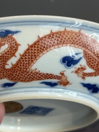 An imperial Chinese blue, white and iron-red 'dragon' plate, Qianlong mark and of the period